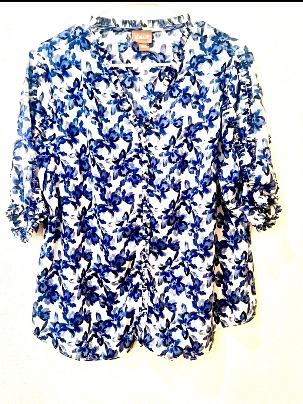 Chico's White Blouse with Blue Floral Print and Ruffle Trim.   Size 2= Large